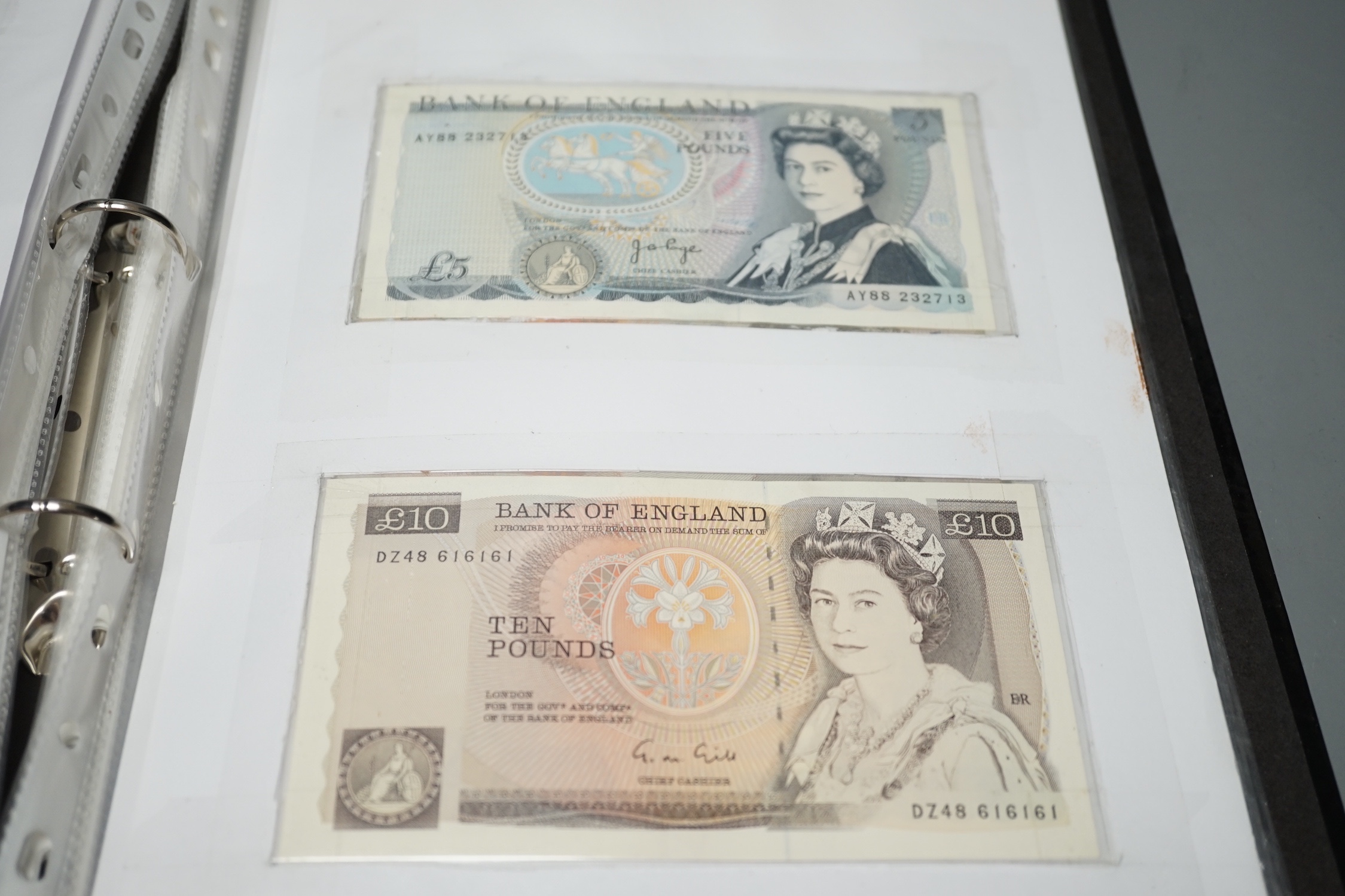 A collection of UK George V to Queen Elizabeth II banknotes, in an album
